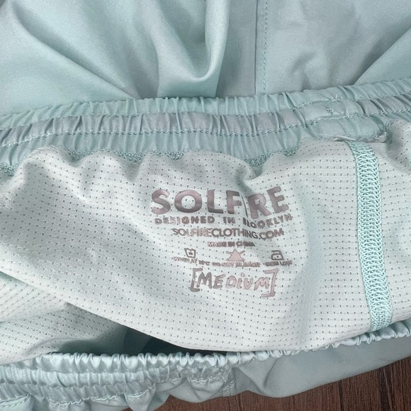 Men’s Peloton x Solfire Mint Green Blue Accelerate Athletic Shorts - Picture 9 of 10